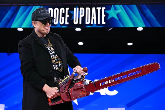 Elon Musk wields a chainsaw while give a 'Doge update' at the annual Conservative Political Action Conference last month (Picture: Saul Loeb)