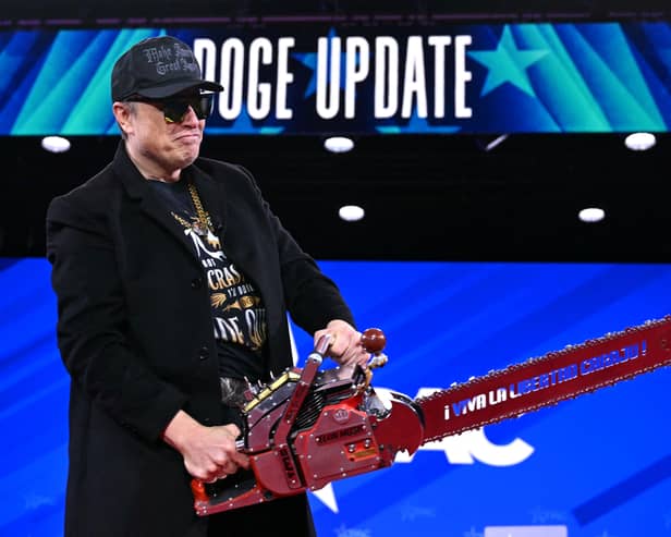 Elon Musk wields a chainsaw while give a 'Doge update' at the annual Conservative Political Action Conference last month (Picture: Saul Loeb)