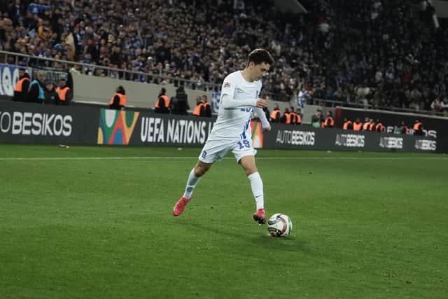 Konstantinos Karetsas in action for Greece during the Nations League play-off first leg against Scotland. (Photo by MENELAOS MYRILLAS/SOOC/AFP via Getty Images)