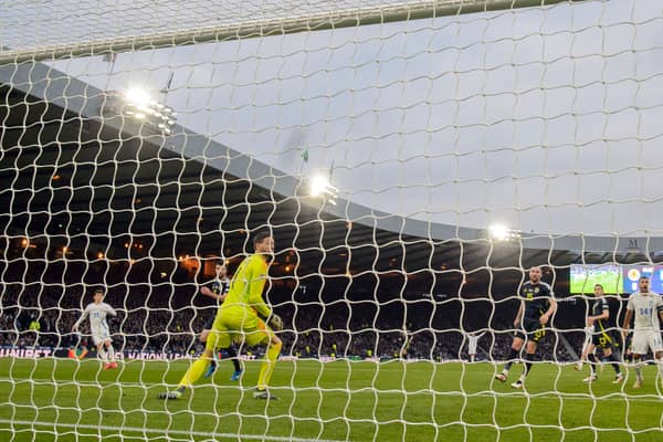 Scotland keeper Craig Gordon watches on helplessly as Konstantinos Karetsas scores Greece's second goal at Hampden.