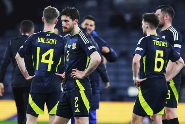 The Scotland players look on crestfallen after the loss at Hampden.