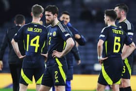 The Scotland players look on crestfallen after the loss at Hampden.