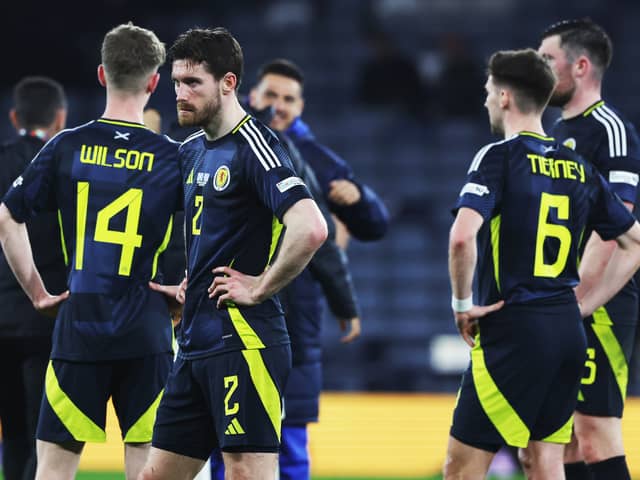 The Scotland players look on crestfallen after the loss at Hampden.