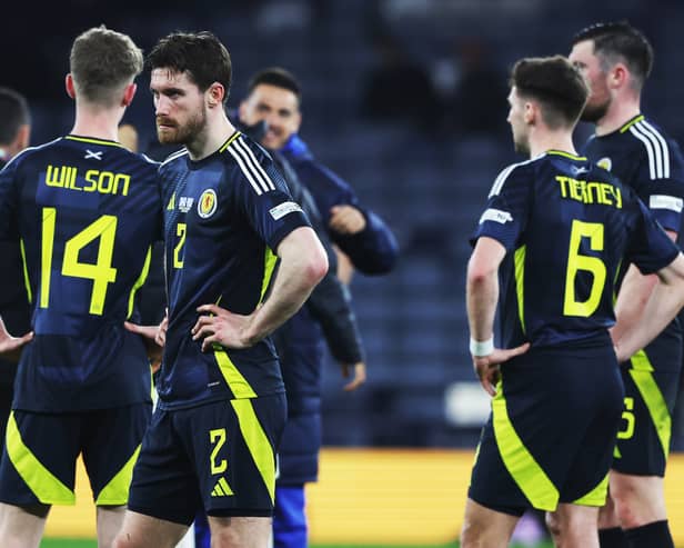 The Scotland players look on crestfallen after the loss at Hampden.