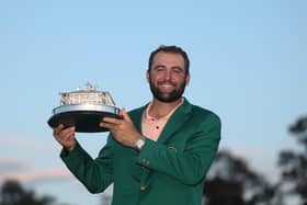 Scottie Scheffler poses with the trophy after winning the 2024 Masters Tournament at Augusta National Golf Club