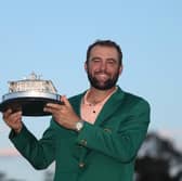 Scottie Scheffler poses with the trophy after winning the 2024 Masters Tournament at Augusta National Golf Club