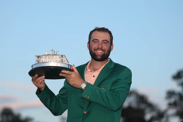 Scottie Scheffler poses with the trophy after winning the 2024 Masters Tournament at Augusta National Golf Club
