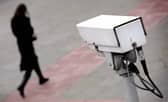 A police CCTV camera observes a woman walking. Picture: Leon Neal/AFP via Getty Images