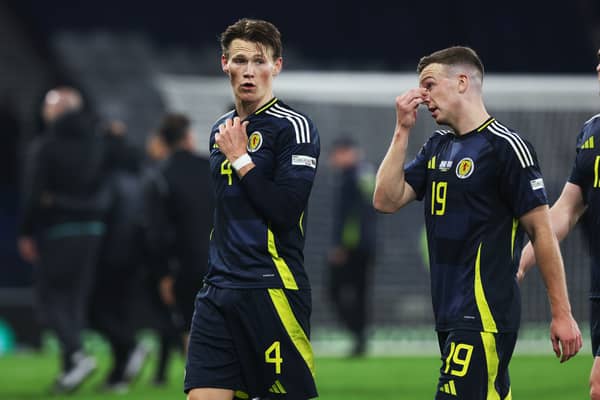 Scotland's Scott McTominay and Lewis Ferguson trudge off after the defeat by Greece.