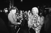 Winnie Ewing is welcomed by supporters, including two bagpipers, as she arrives in London to take her seat in the House of Commons in 1967
