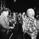 Winnie Ewing is welcomed by supporters, including two bagpipers, as she arrives in London to take her seat in the House of Commons in 1967