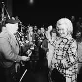 Winnie Ewing is welcomed by supporters, including two bagpipers, as she arrives in London to take her seat in the House of Commons in 1967