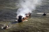 Tug boats shadow the Solong container ship as it drifts in the Humber Estuary, off the coast of East Yorkshire, following the collision with the MV Stena Immaculate oil tanker