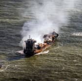 Tug boats shadow the Solong container ship as it drifts in the Humber Estuary, off the coast of East Yorkshire, following the collision with the MV Stena Immaculate oil tanker