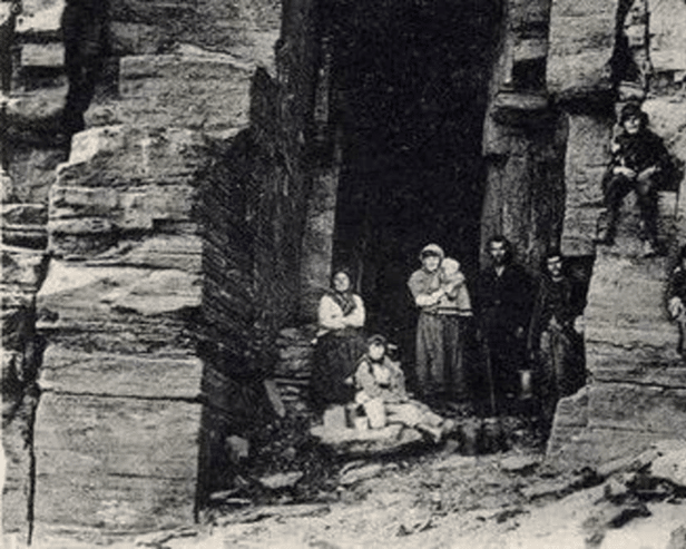 Travellers living in a cave near Wick, Caithness, around 1911. 
PIC: The Johnston Collection/Wick