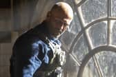 Jason Statham as Levon Cade in A Working Man