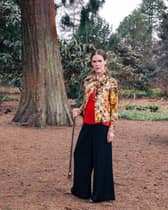 Linder at the Royal Botanic Gardens Edinburgh for EAF and Mount Stuart, 2025. Photo: Charlotte Cullen. Outfit: Ashish. Stylist: Rebecca Palmer. Make-up: Kala Williams. Courtesy the artist and EAF.