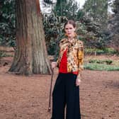 Linder at the Royal Botanic Gardens Edinburgh for EAF and Mount Stuart, 2025. Photo: Charlotte Cullen. Outfit: Ashish. Stylist: Rebecca Palmer. Make-up: Kala Williams. Courtesy the artist and EAF.