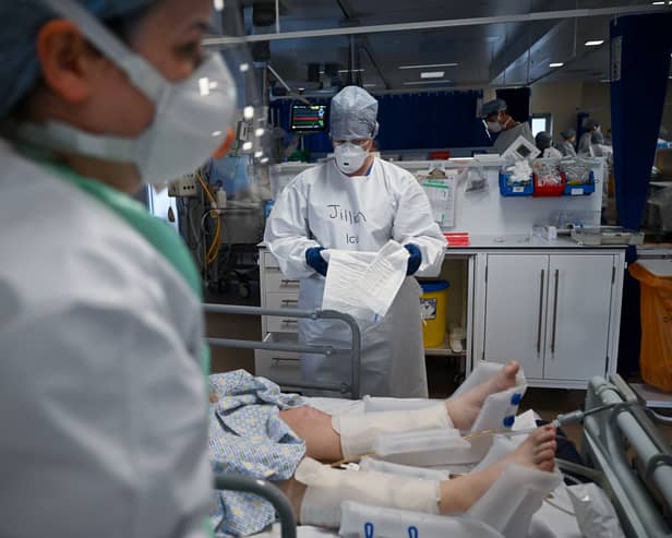 Staff at University Hospital Monklands in Airdrie attend to a Covid-positive patient in intensive care in February 2021 (Picture: Jeff J Mitchell)