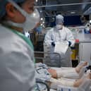 Staff at University Hospital Monklands in Airdrie attend to a Covid-positive patient in intensive care in February 2021 (Picture: Jeff J Mitchell)