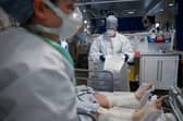 Staff at University Hospital Monklands in Airdrie attend to a Covid-positive patient in intensive care in February 2021 (Picture: Jeff J Mitchell)