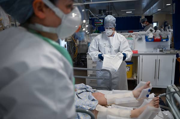 Staff at University Hospital Monklands in Airdrie attend to a Covid-positive patient in intensive care in February 2021 (Picture: Jeff J Mitchell)