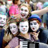 Fringe performers pose during a performance