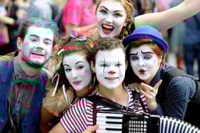 Fringe performers pose during a performance