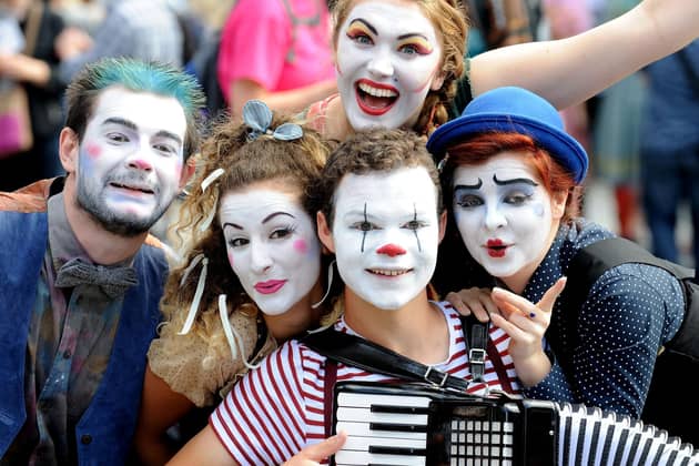 Fringe performers pose during a performance