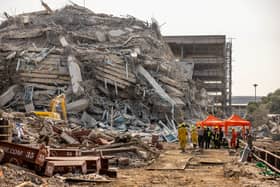 BANGKOK, THAILAND - MARCH 28: Thai rescue workers arrive on scene at a construction building collapse in the Chatuchak area following an earthquake on March 28, 2025 in Bangkok, Thailand. A powerful 7.7 magnitude earthquake struck Myanmar earlier today, causing strong tremors that were felt in Bangkok, where buildings swayed and hundreds of people evacuated onto the streets. (Photo by Lauren DeCicca/Getty Images)