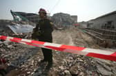 A rescuer at the site of a high-rise building under construction that collapsed after a 7.7 magnitude earthquake in Bangkok, Thailand