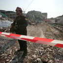 A rescuer at the site of a high-rise building under construction that collapsed after a 7.7 magnitude earthquake in Bangkok, Thailand