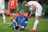 Denmark defender Victor Kristiansen checks on goalkeeper Kasper Schmeichel during the Nations League quarter final second leg against Portugal at the Jose Alvalade stadium in Lisbon, on March 23, 2025.  (Photo by PATRICIA DE MELO MOREIRA/AFP via Getty Images)          