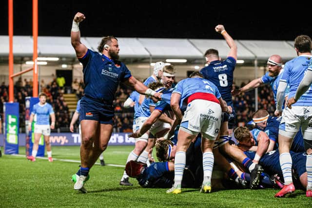 Pierre Schoeman celebrates an Edinburgh try.