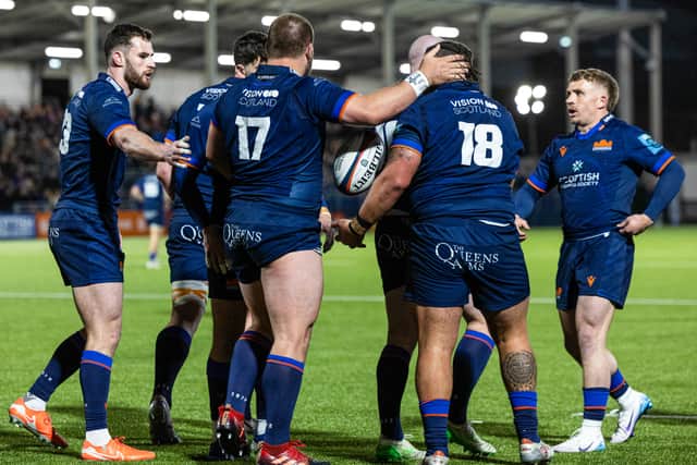 Edinburgh's players celebrate during the win over Dragons.
