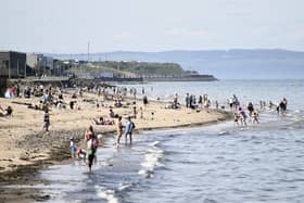 People flock to Portobello Beach in the sunshine
