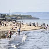 People flock to Portobello Beach in the sunshine