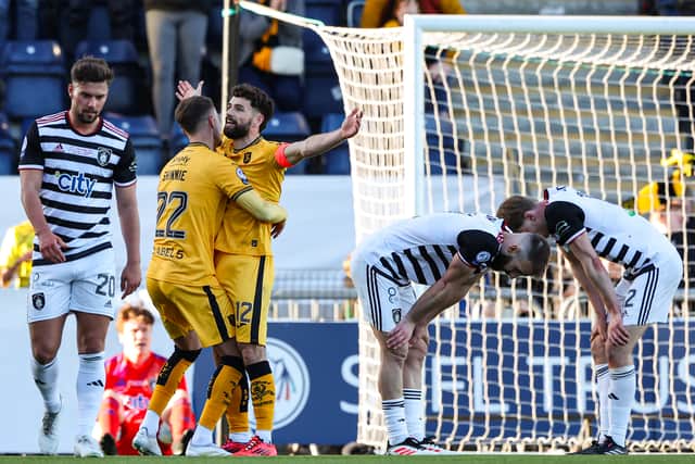 Jamie Brandon is congratulated on his stunning fifth goal for Livingston.