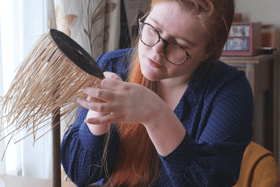 Historical costumier Lilja Husmo recreating the 'unique' Bronze Age horsehair hat found in the Highlands. PIC: Sandy Scullion.