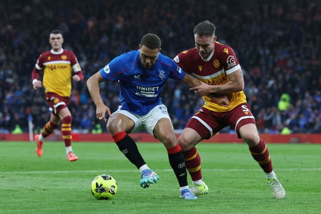 Cyriel Dessers of Rangers FC is challenged by Kofi Balmer of Motherwell in lat season’s Premier Sports Cup semi-final.