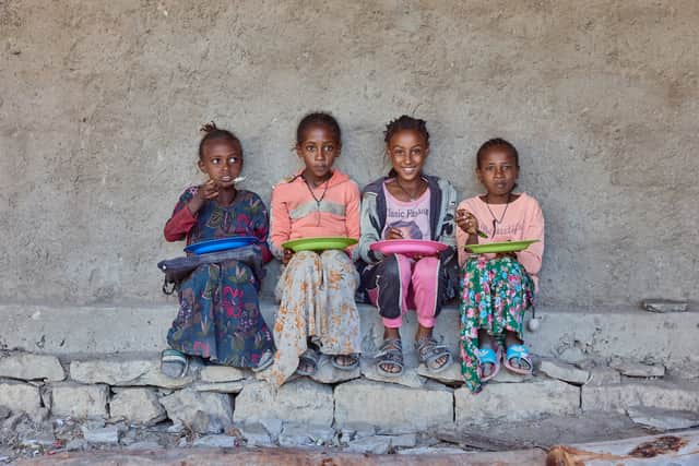 Children from Beati Akor primary school in Tigray eating food provided by Mary's Meals.