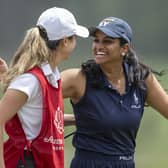 Megha Ganne of United States is congratulated by the her caddie Brooke Riley after scoring a record 63 in the first round of the Augusta National Women's Amateur at Champions Retreat Golf Club