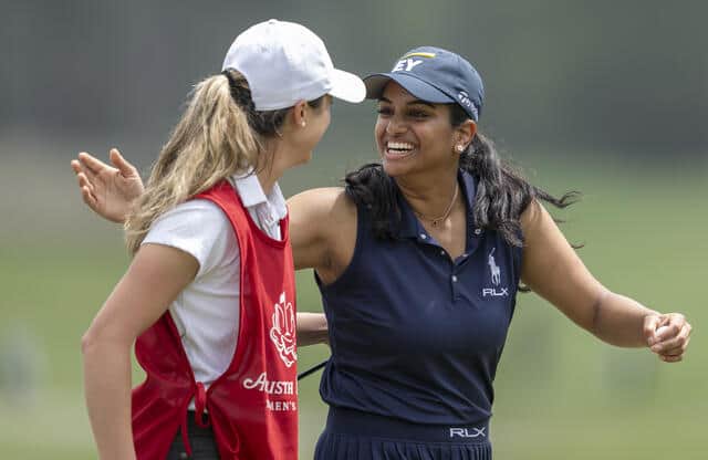 Megha Ganne of United States is congratulated by the her caddie Brooke Riley after scoring a record 63 in the first round of the Augusta National Women's Amateur at Champions Retreat Golf Club