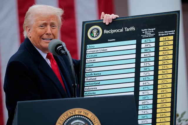President Donald Trump holds up a chart of "reciprocal tariffs" while speaking during a trade announcement event in the Rose Garden at the White House. Picture: Chip Somodevilla/Getty Images