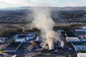 Fire fighters at the scene of a fire at an industrial unit in Broomlee Road, Cumbernauld, North Lanarkshire. Picture: Andrew Milligan/PA Wire