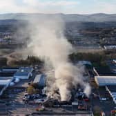 Fire fighters at the scene of a fire at an industrial unit in Broomlee Road, Cumbernauld, North Lanarkshire. Picture: Andrew Milligan/PA Wire