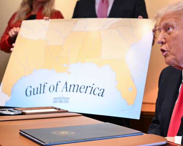 Donald Trump with a map showing the northern part of the Gulf of Mexico (Picture: Roberto Schmidt)
