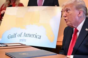 Donald Trump with a map showing the northern part of the Gulf of Mexico (Picture: Roberto Schmidt)