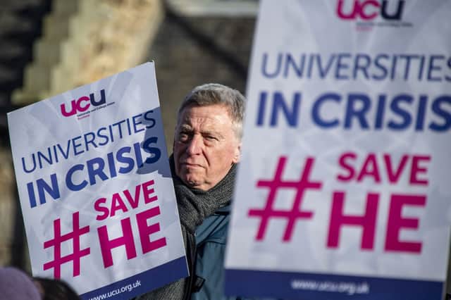 University staff hold a rally outside the Scottish Parliament to protest against threatened job cuts and demand a fair budget for higher education (Picture: Lisa Ferguson)