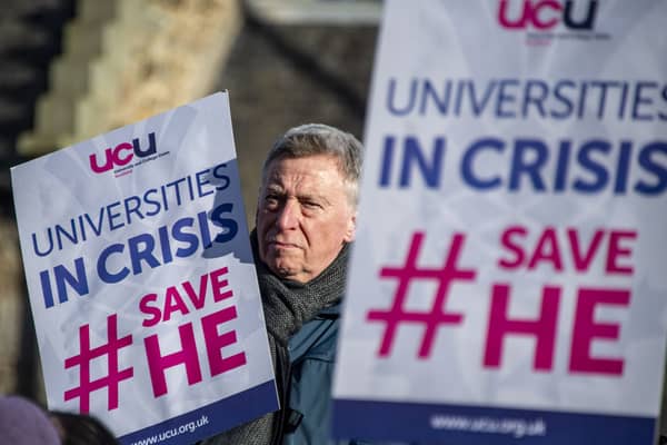University staff hold a rally outside the Scottish Parliament to protest against threatened job cuts and demand a fair budget for higher education (Picture: Lisa Ferguson)